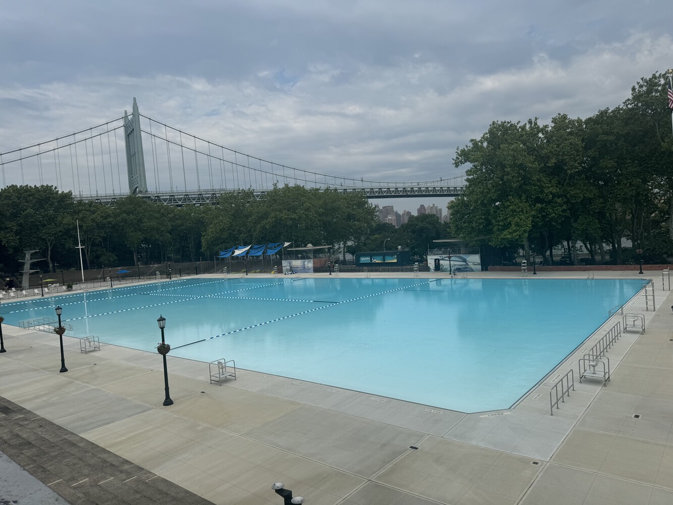19-19 24th Avenue, Unit 102 Queens, NY 11102 - Photo 31 of 36 a view of a lake with a floor to ceiling window and wooden fence