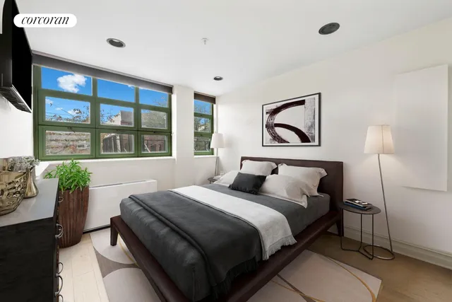 a bedroom with a bed and a couch