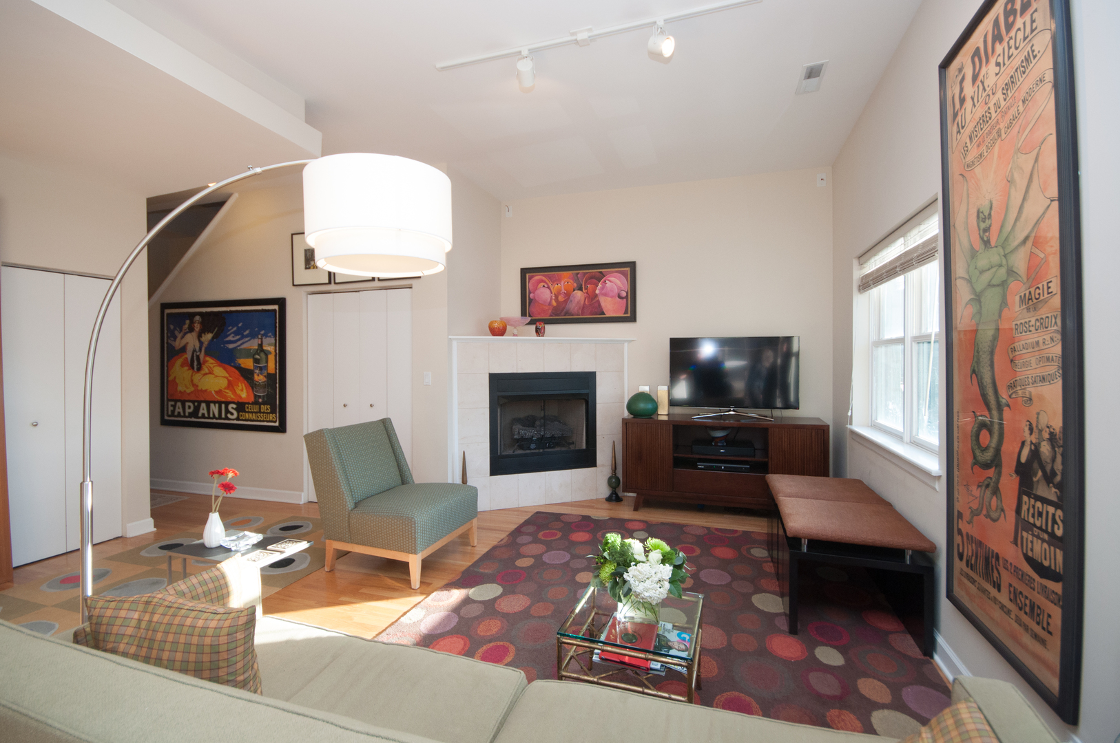 4646 North Beacon Street, Unit 203 Chicago, IL 60640 - Photo 12 of 24 a living room with furniture fireplace and a flat screen tv