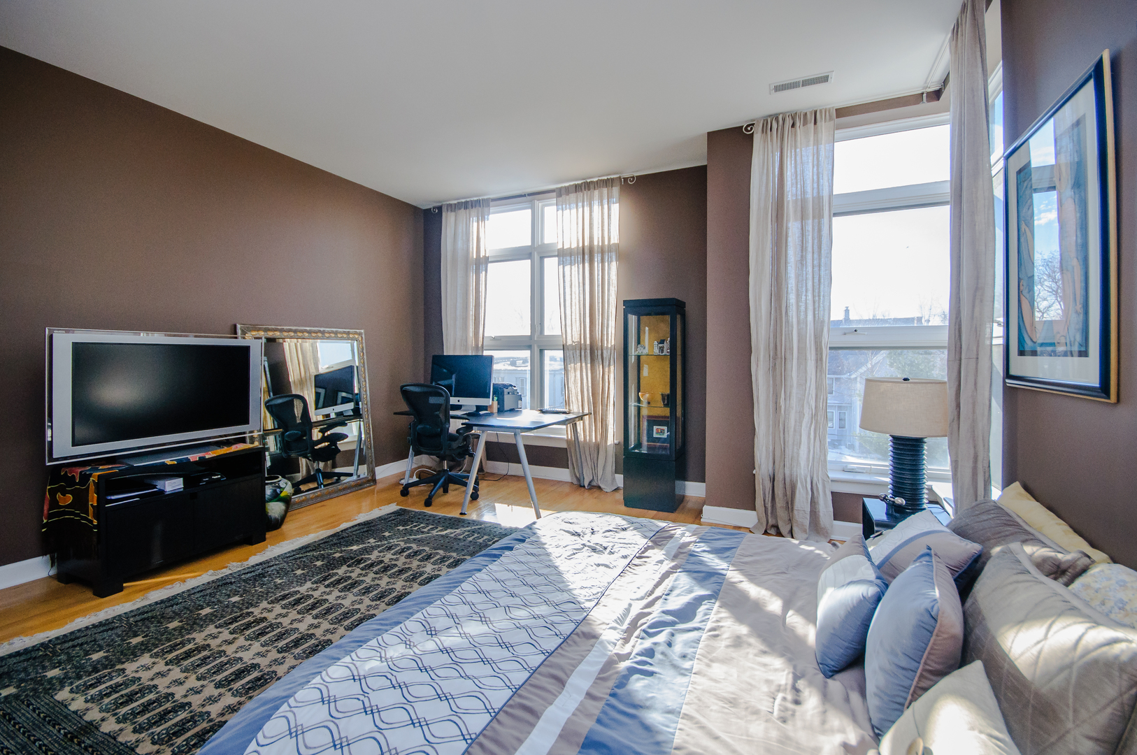 4646 North Beacon Street, Unit 203 Chicago, IL 60640 - Photo 13 of 24 a living room with furniture and a flat screen tv