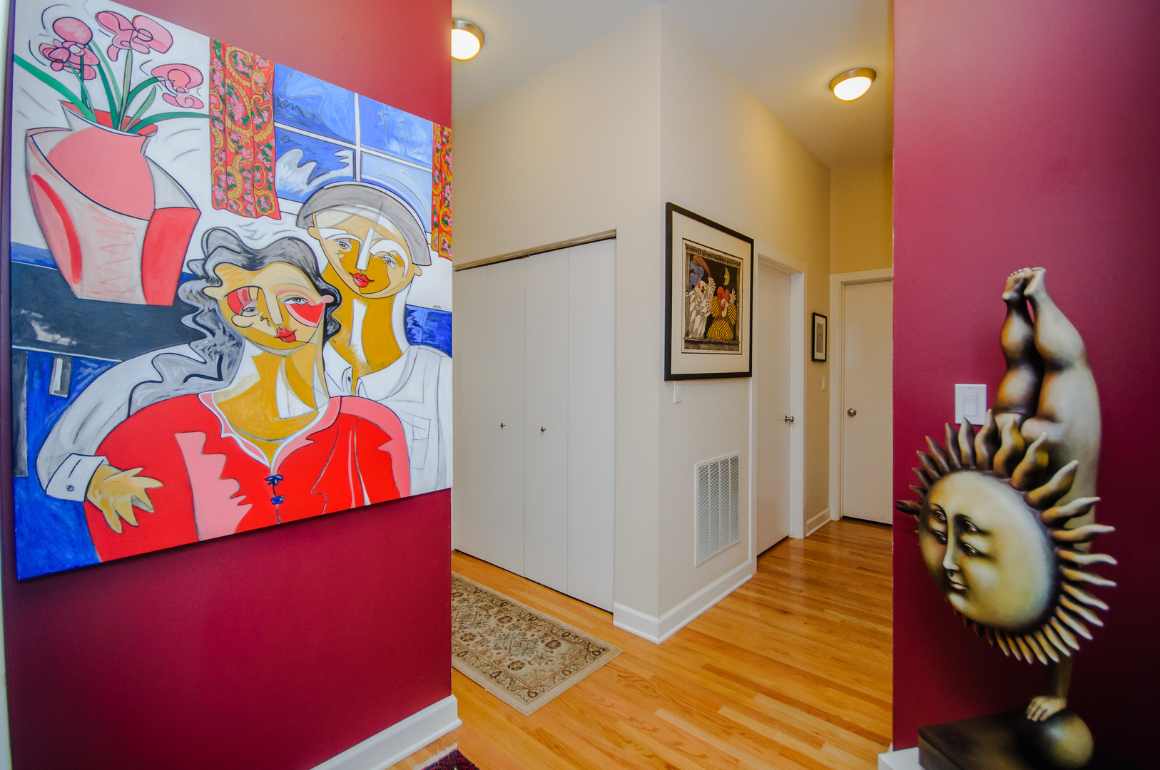 4646 North Beacon Street, Unit 203 Chicago, IL 60640 - Photo 2 of 24 a bedroom with a bed and painting on the wall