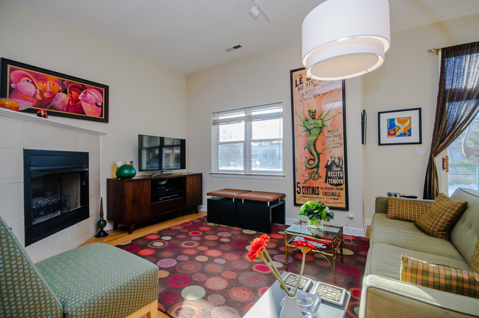 4646 North Beacon Street, Unit 203 Chicago, IL 60640 - Photo 3 of 24 a living room with furniture a flat screen tv and a fireplace