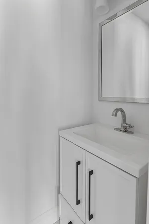 a bathroom with a sink and mirror