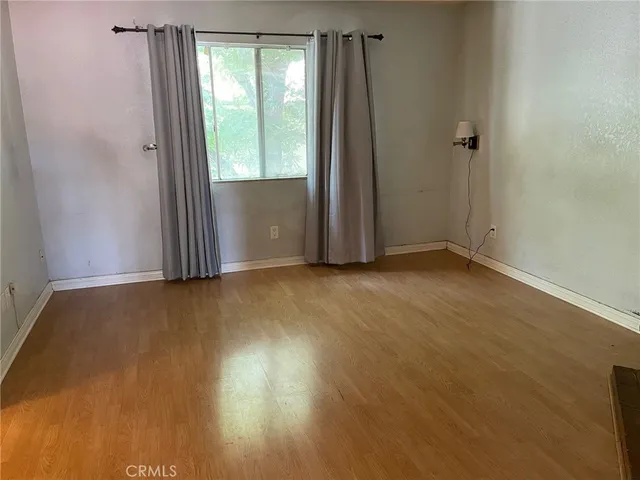 a view of an empty room with a fireplace