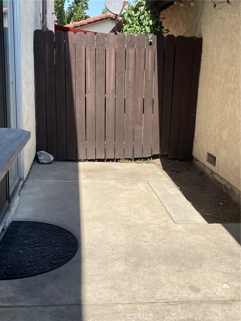 1077 South Santo Antonio Drive, Unit 15 Colton, CA 92324 - Photo 18 of 20 a view of a wooden door