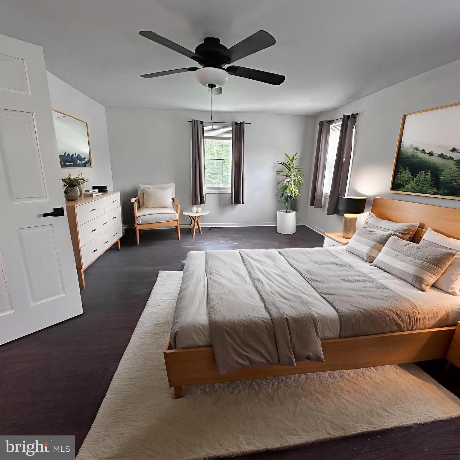 8908 Eastbourne Lane Laurel, MD 20708 - Photo 15 of 26 a bedroom with a large bed and a window