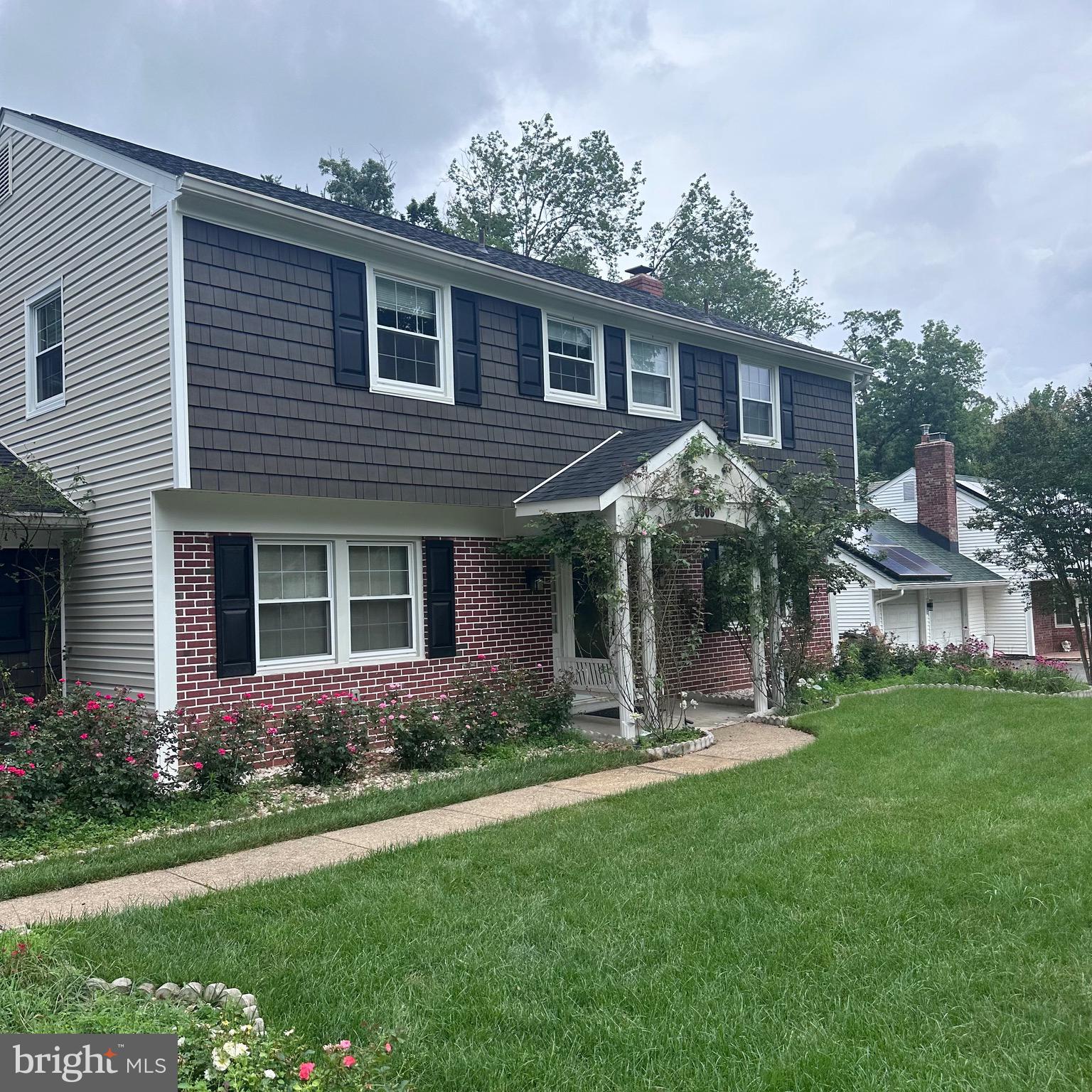 8908 Eastbourne Lane Laurel, MD 20708 - Photo 26 of 26 a front view of a house with a yard and green space
