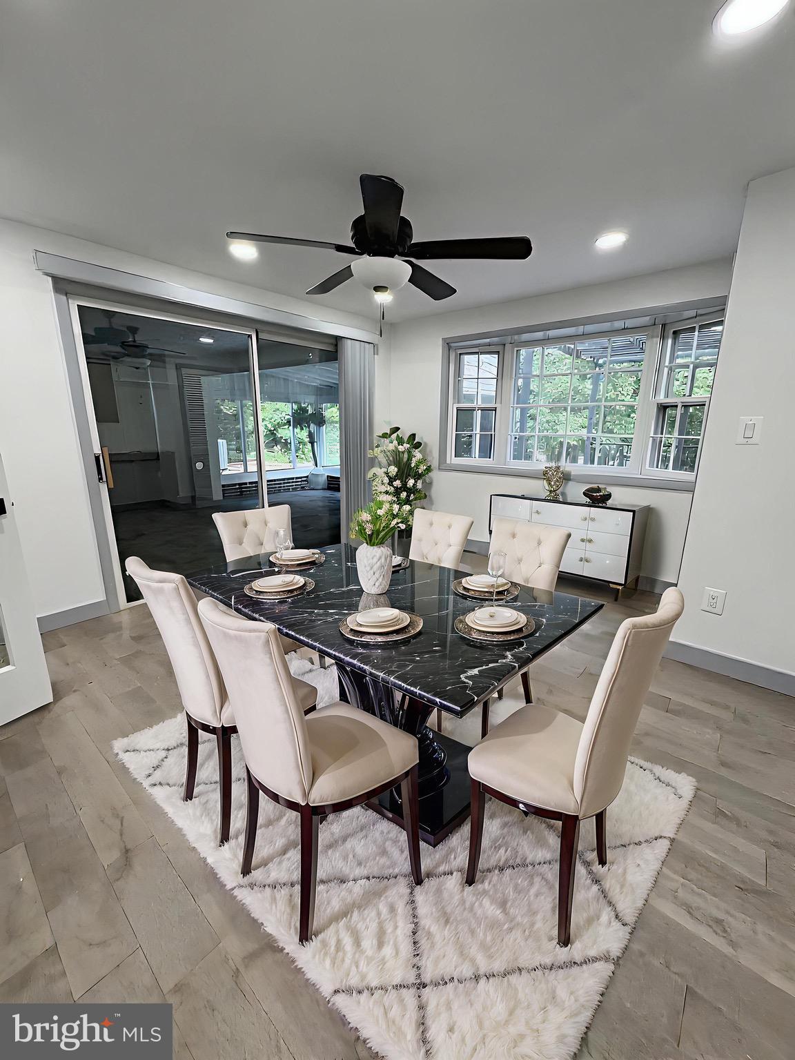 8908 Eastbourne Lane Laurel, MD 20708 - Photo 7 of 26 a view of a dining room with furniture window and outside view