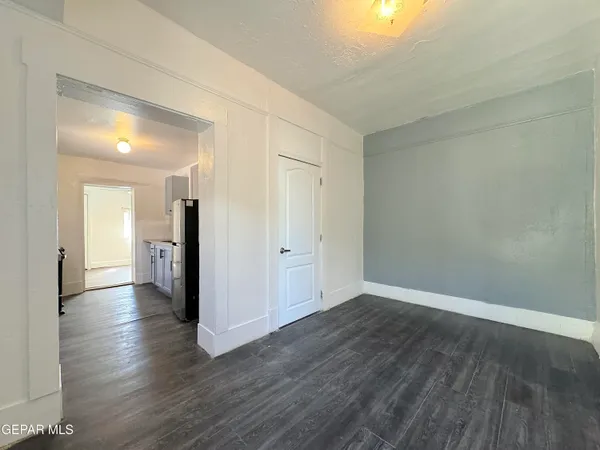 a kitchen with stainless steel appliances granite countertop a refrigerator stove and sink