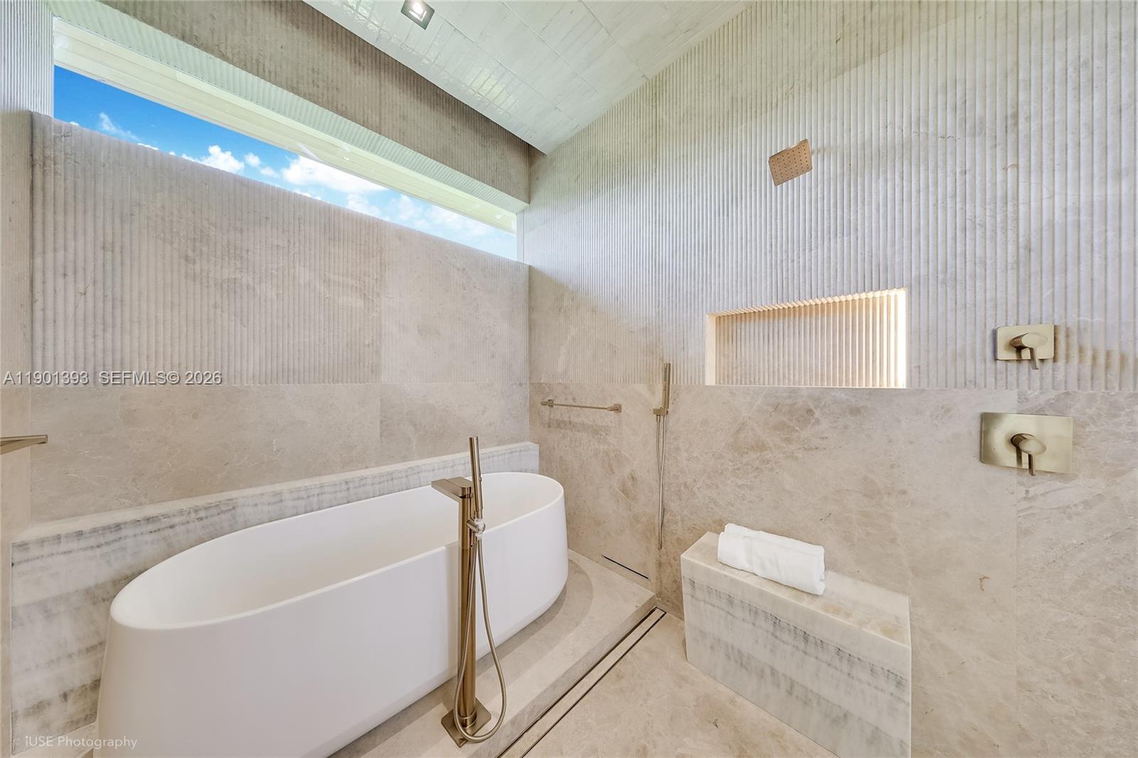 770 Lake Road Miami, FL 33137 - Photo 12 of 40 a bathroom with a white bath tub a toilet and a sink