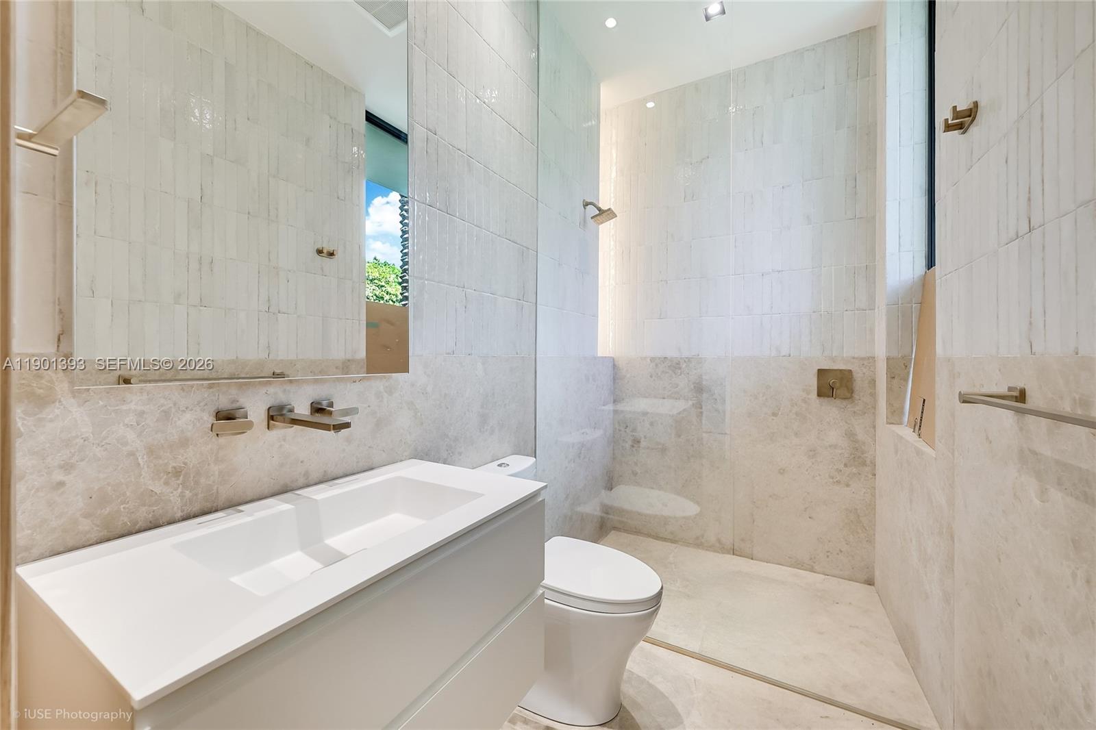770 Lake Road Miami, FL 33137 - Photo 20 of 40 a bathroom with a sink a toilet and shower