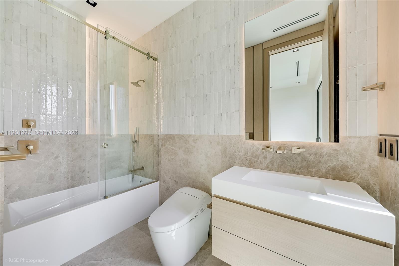 770 Lake Road Miami, FL 33137 - Photo 24 of 40 a bathroom with a granite countertop sink and a bathtub