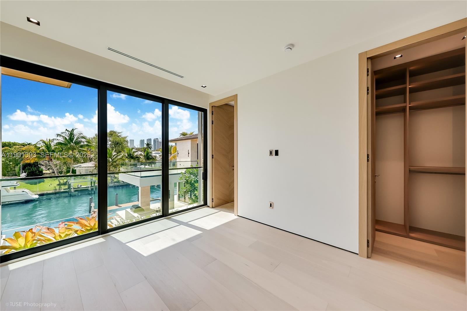 770 Lake Road Miami, FL 33137 - Photo 25 of 40 a view of a room with a large window and wooden floor