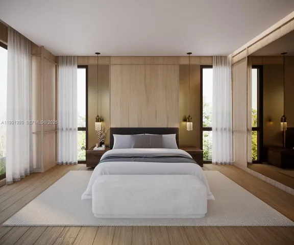 a large bedroom with a large bed and a chandelier