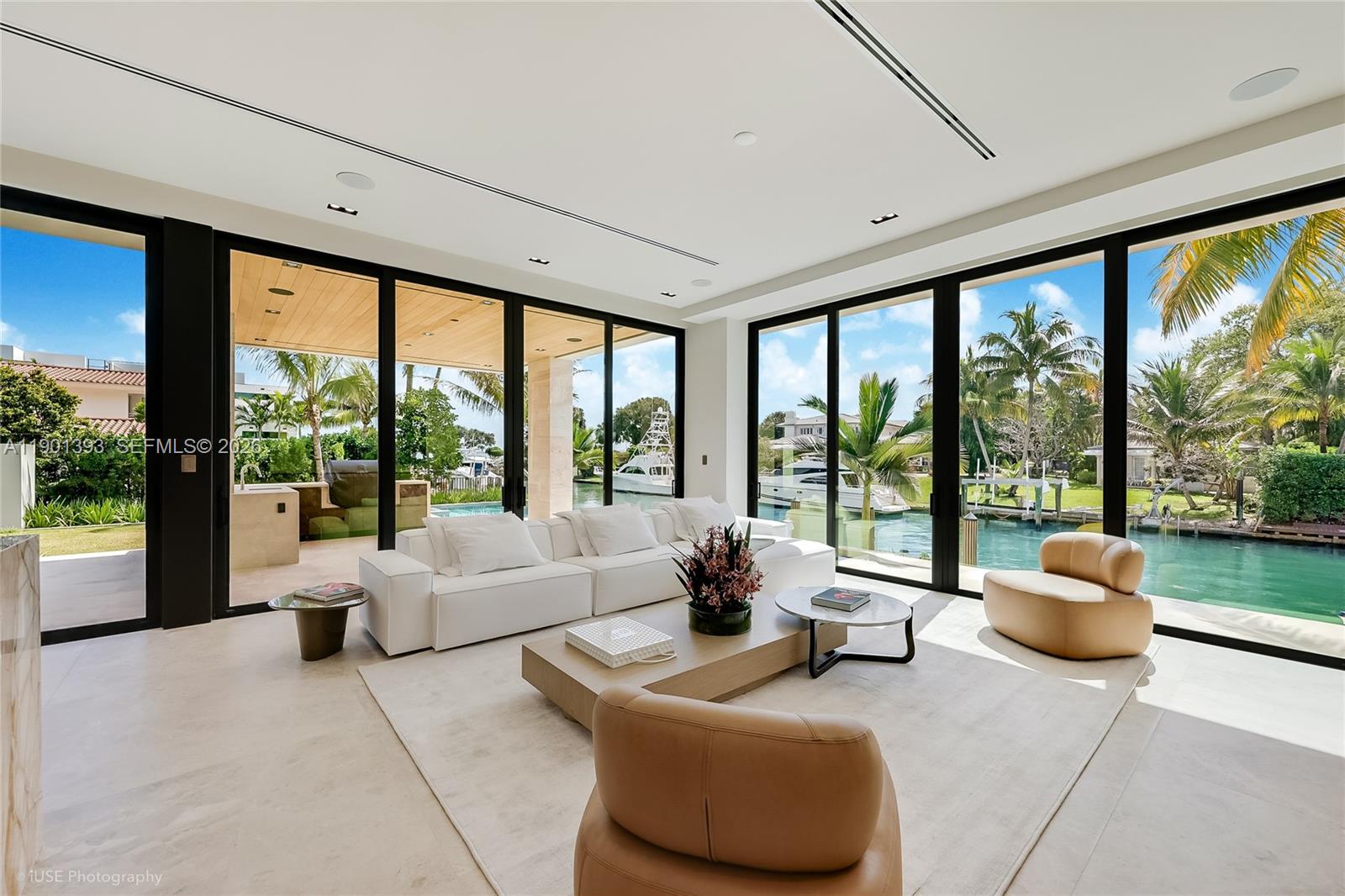 770 Lake Road Miami, FL 33137 - Photo 5 of 40 a living room with furniture and floor to ceiling windows