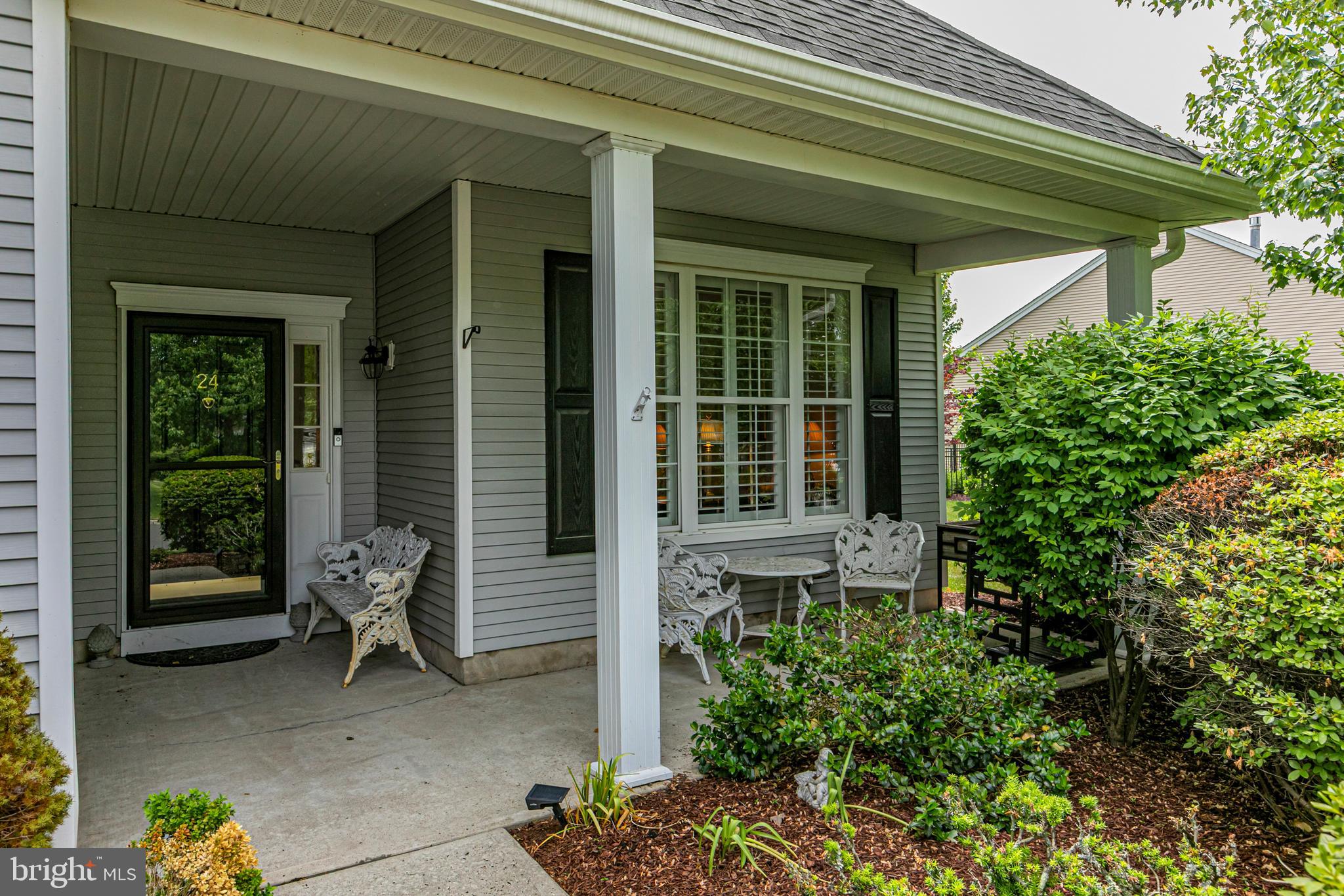 24 Foster Road Pennington, NJ 08534 - Photo 2 of 38 a house with potted plants in front of door