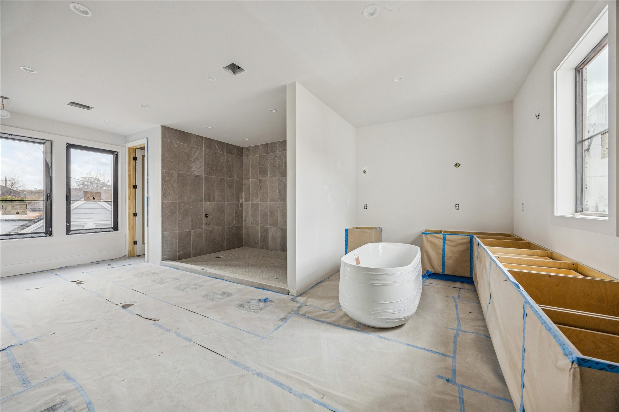 2217 Pelham Drive Houston, TX 77019 - Photo 19 of 21 Primary bathroom features custom cabinetry, his and her water closets, and a large wet room.