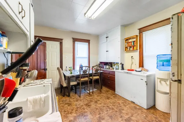 a view of a workspace with furniture and a living room