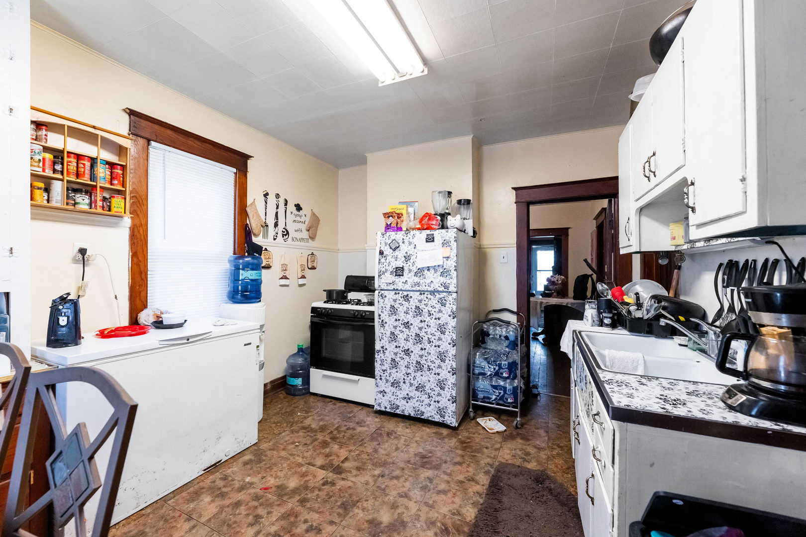 436 South 4th Avenue Kankakee, IL 60901 - Photo 14 of 32 a view of a kitchen with fridge and workspace