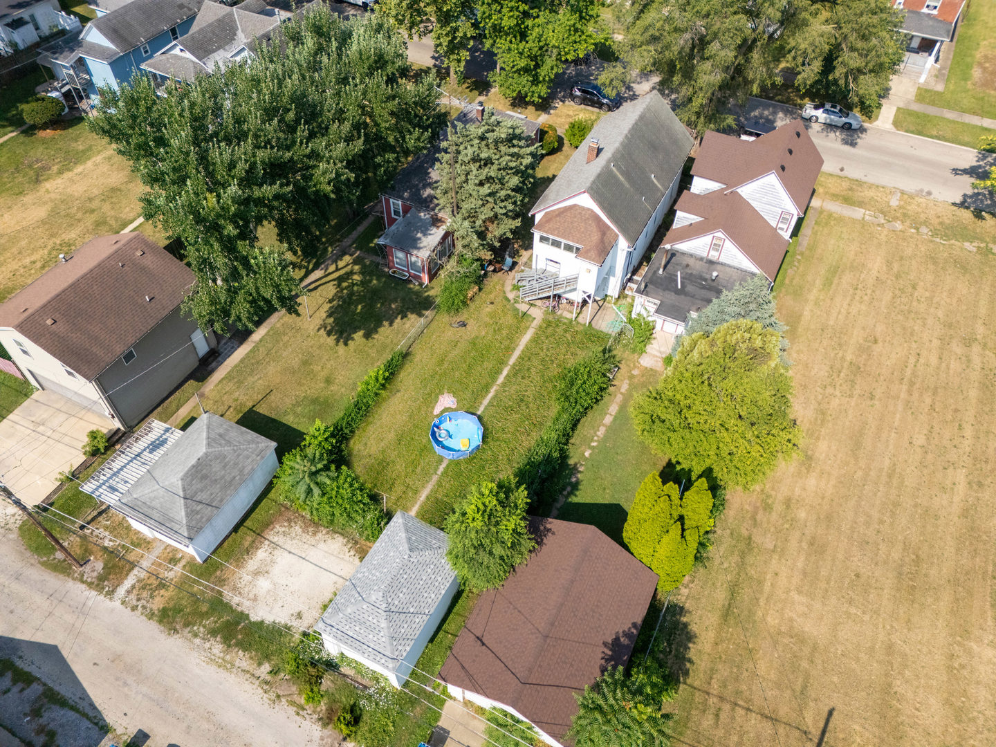 436 South 4th Avenue Kankakee, IL 60901 - Photo 26 of 32 an aerial view of a house with garden space and swimming pool
