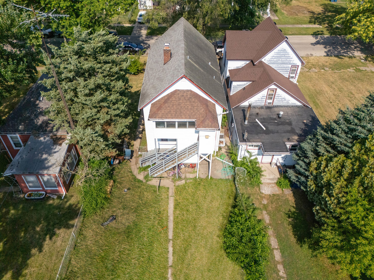436 South 4th Avenue Kankakee, IL 60901 - Photo 30 of 32 an aerial view of residential houses with outdoor space and trees