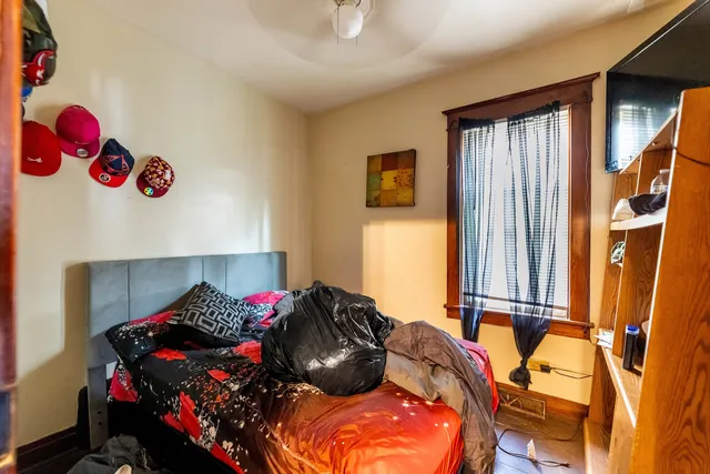 a bedroom with a bed and a window