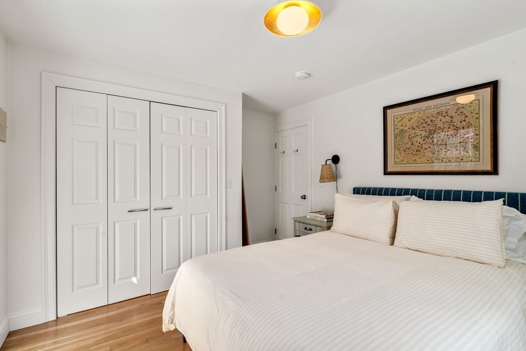 193 Gorwin Drive Holliston, MA 01746 - Photo 13 of 23 a bedroom with a bed and a painting on the wall