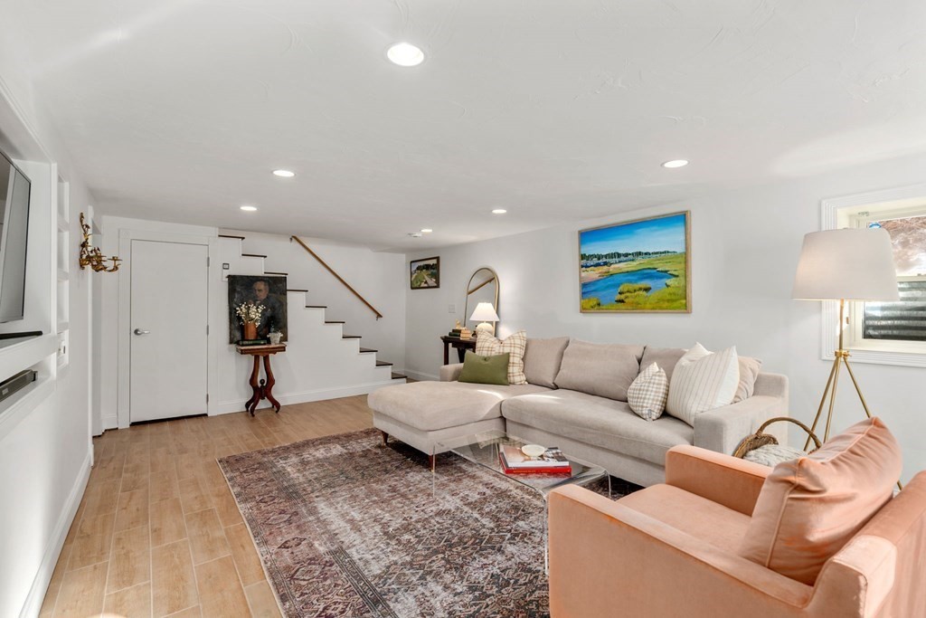 193 Gorwin Drive Holliston, MA 01746 - Photo 17 of 23 a living room with furniture and a rug