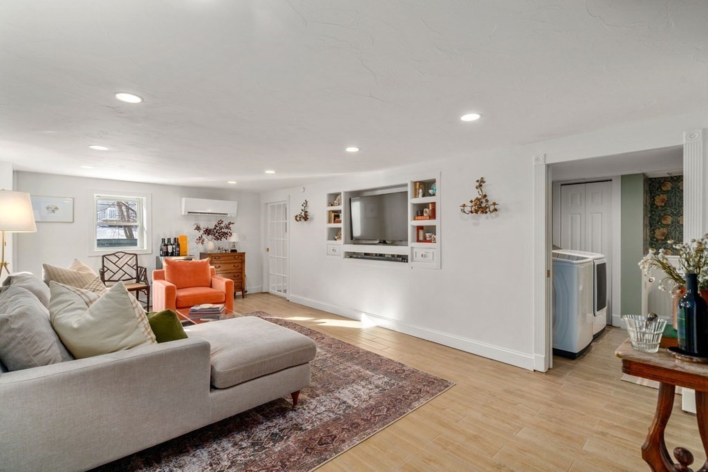 193 Gorwin Drive Holliston, MA 01746 - Photo 18 of 23 a living room with furniture and a wooden floor