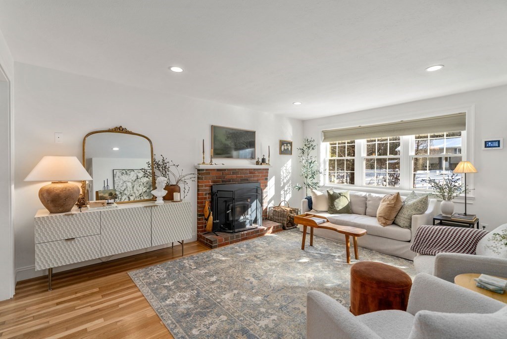 193 Gorwin Drive Holliston, MA 01746 - Photo 6 of 23 a living room with furniture and a fireplace