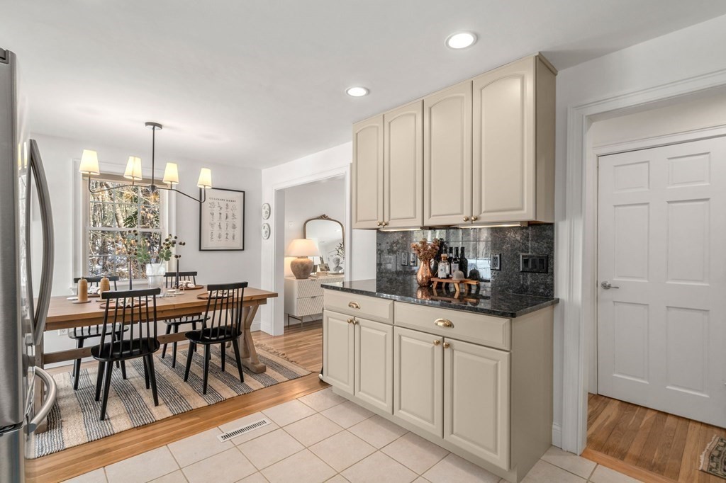 193 Gorwin Drive Holliston, MA 01746 - Photo 9 of 23 a kitchen with white cabinets and sink