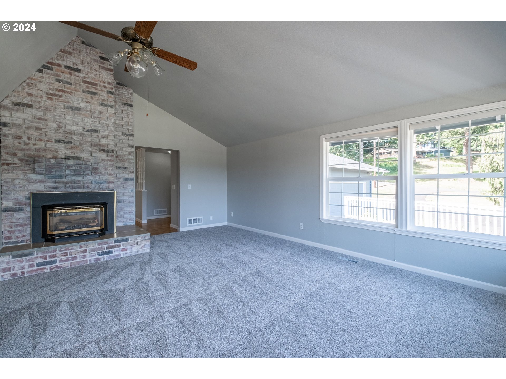 30521 Rancho Road Lebanon, OR 97355 - Photo 16 of 39 a view of empty room with a fireplace