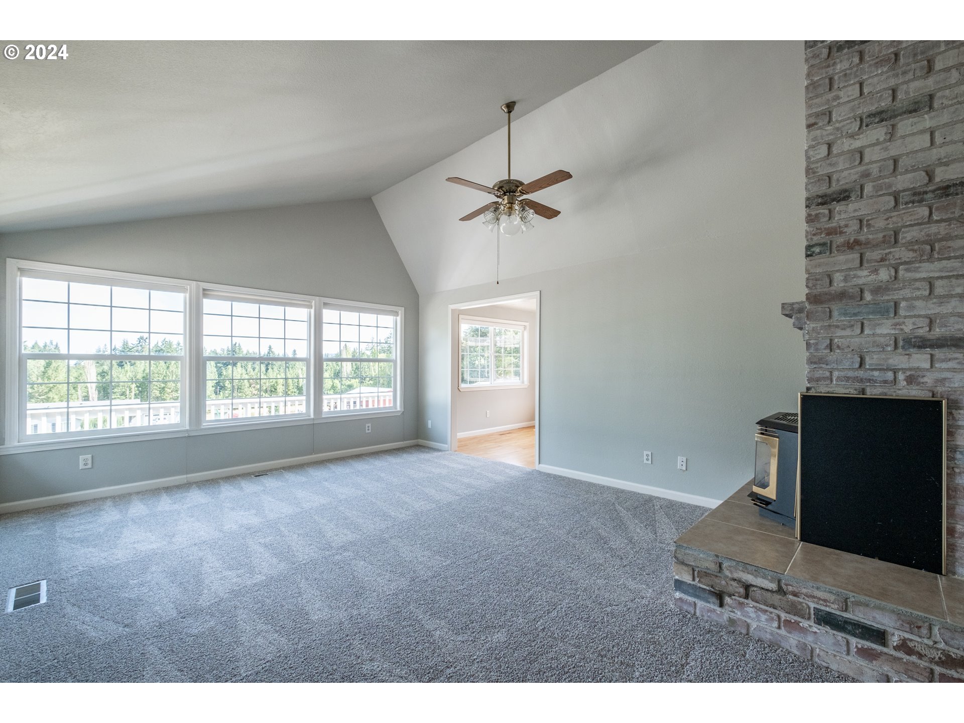 30521 Rancho Road Lebanon, OR 97355 - Photo 17 of 39 a living room with furniture and a fireplace