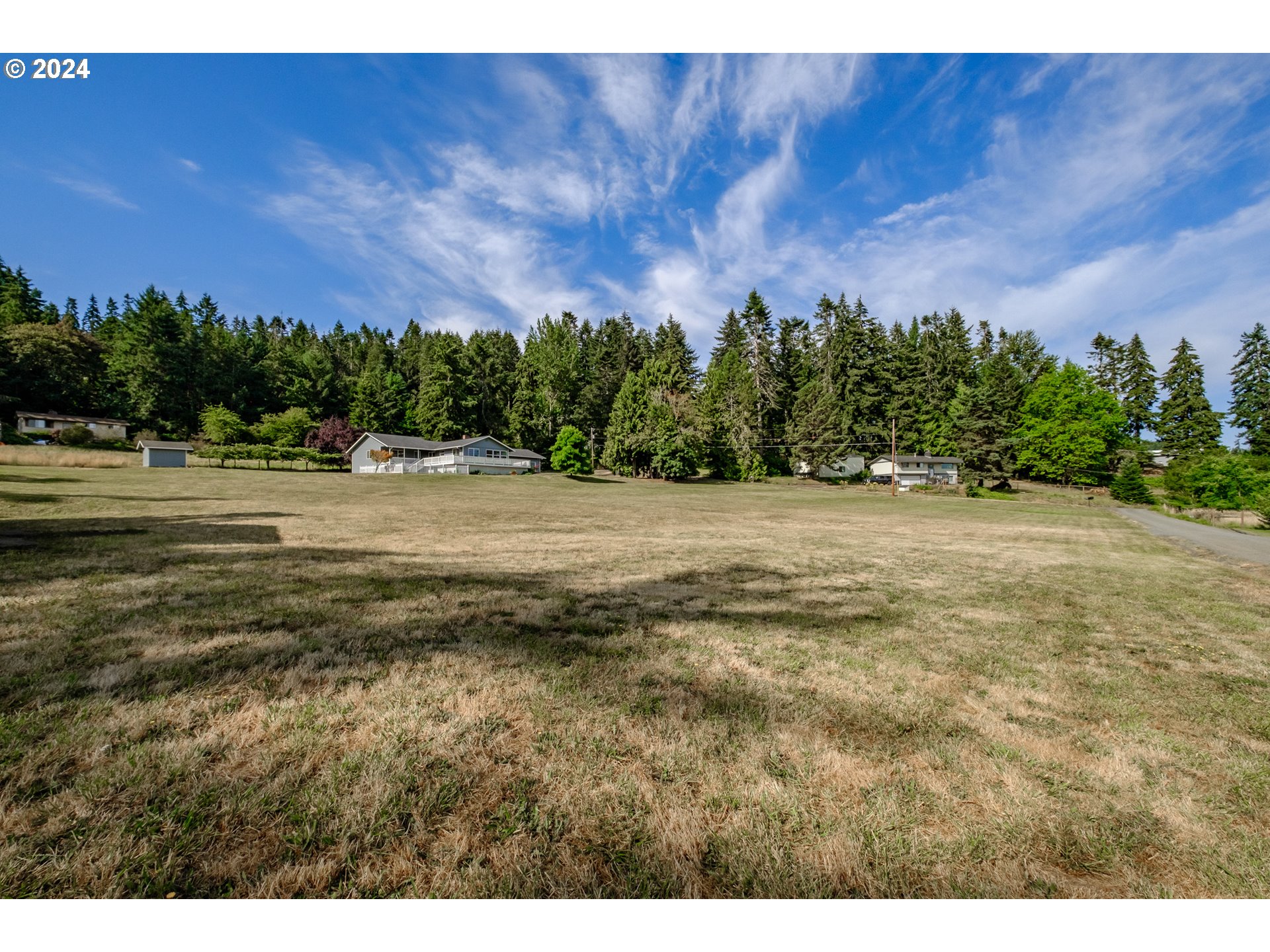 30521 Rancho Road Lebanon, OR 97355 - Photo 2 of 39 a view of a field with an ocean