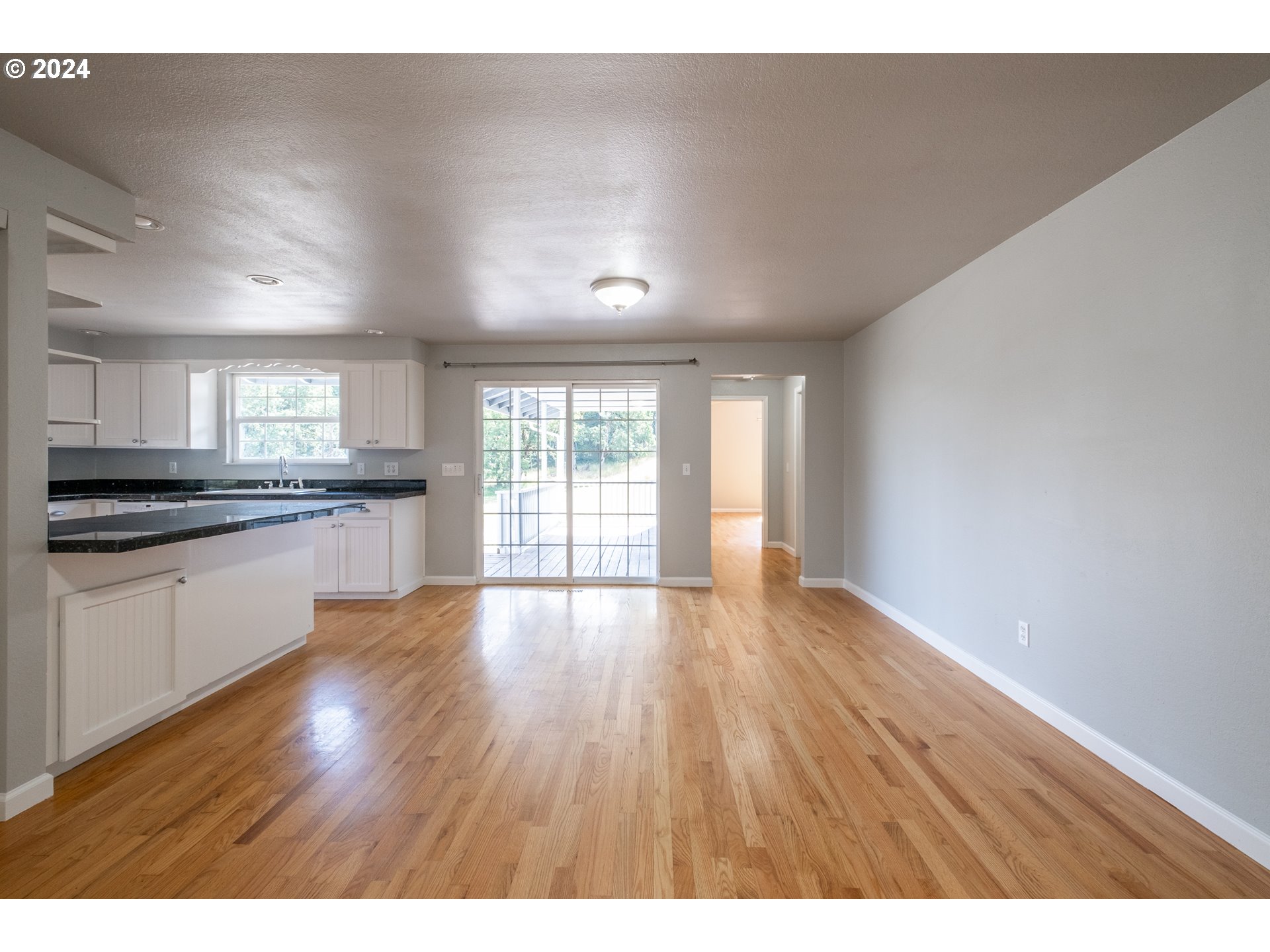 30521 Rancho Road Lebanon, OR 97355 - Photo 23 of 39 a view of kitchen with wooden floor and electronic appliances