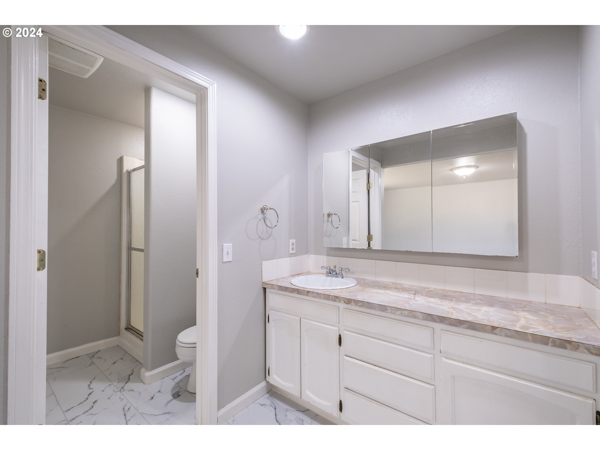 30521 Rancho Road Lebanon, OR 97355 - Photo 27 of 39 a bathroom with a granite countertop sink mirror and toilet