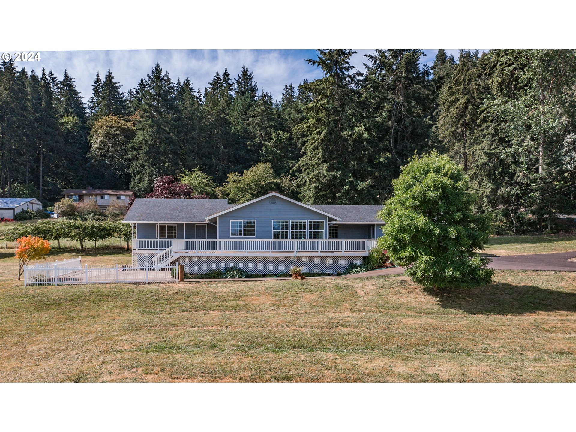 30521 Rancho Road Lebanon, OR 97355 - Photo 35 of 39 a view of a house with a yard