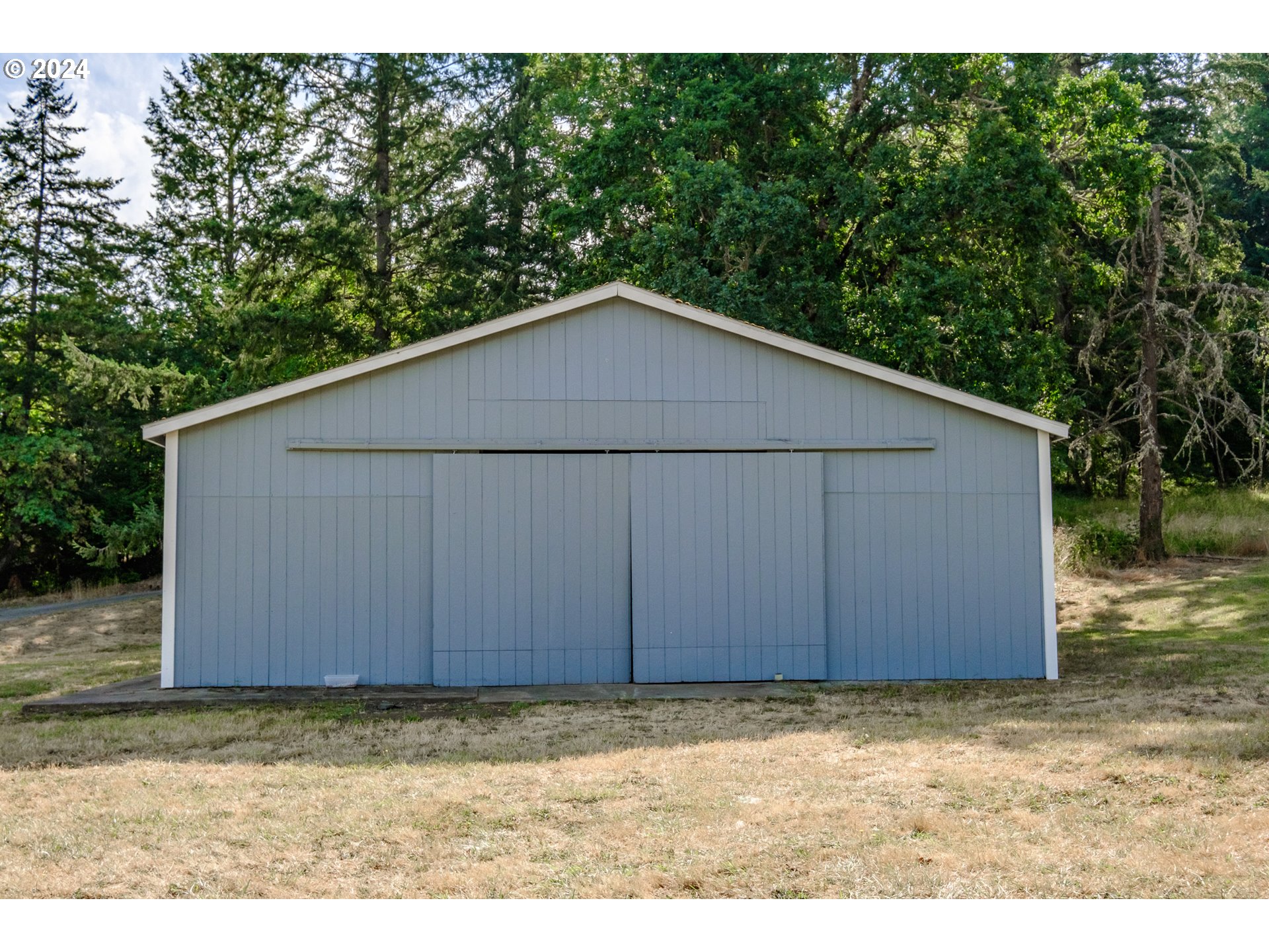 30521 Rancho Road Lebanon, OR 97355 - Photo 4 of 39 a wooden house with a small yard