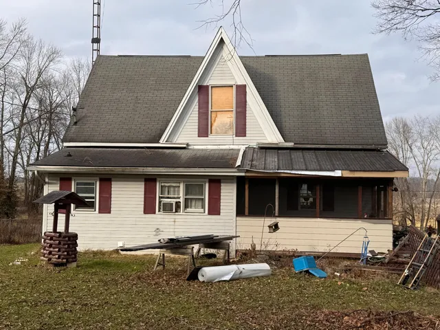 a house view with a outdoor seating