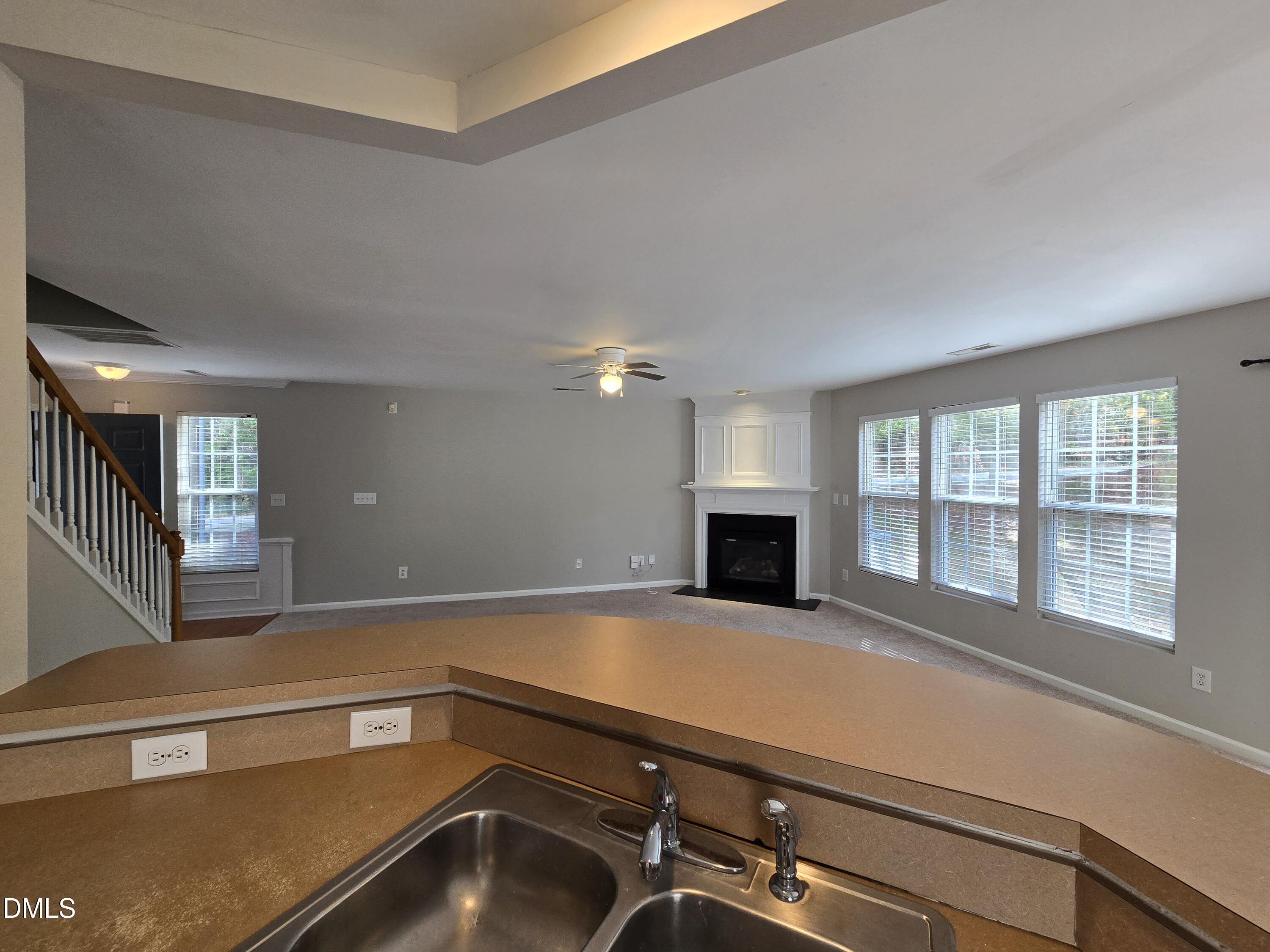 5030 Reservoir Road Raleigh, NC 27610 - Photo 11 of 31 a view of an empty room with fireplace and a window