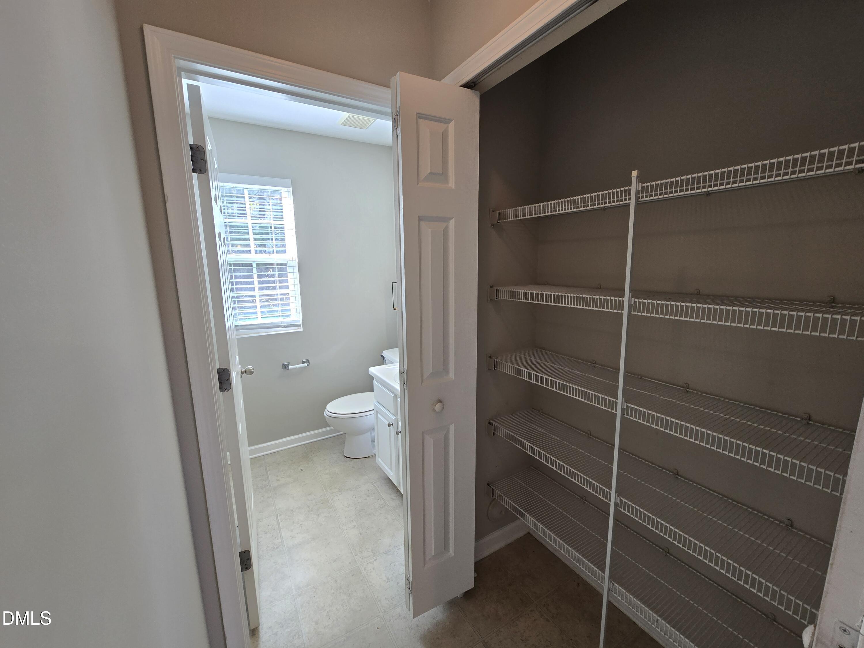 5030 Reservoir Road Raleigh, NC 27610 - Photo 16 of 31 a bathroom with a toilet and a sink