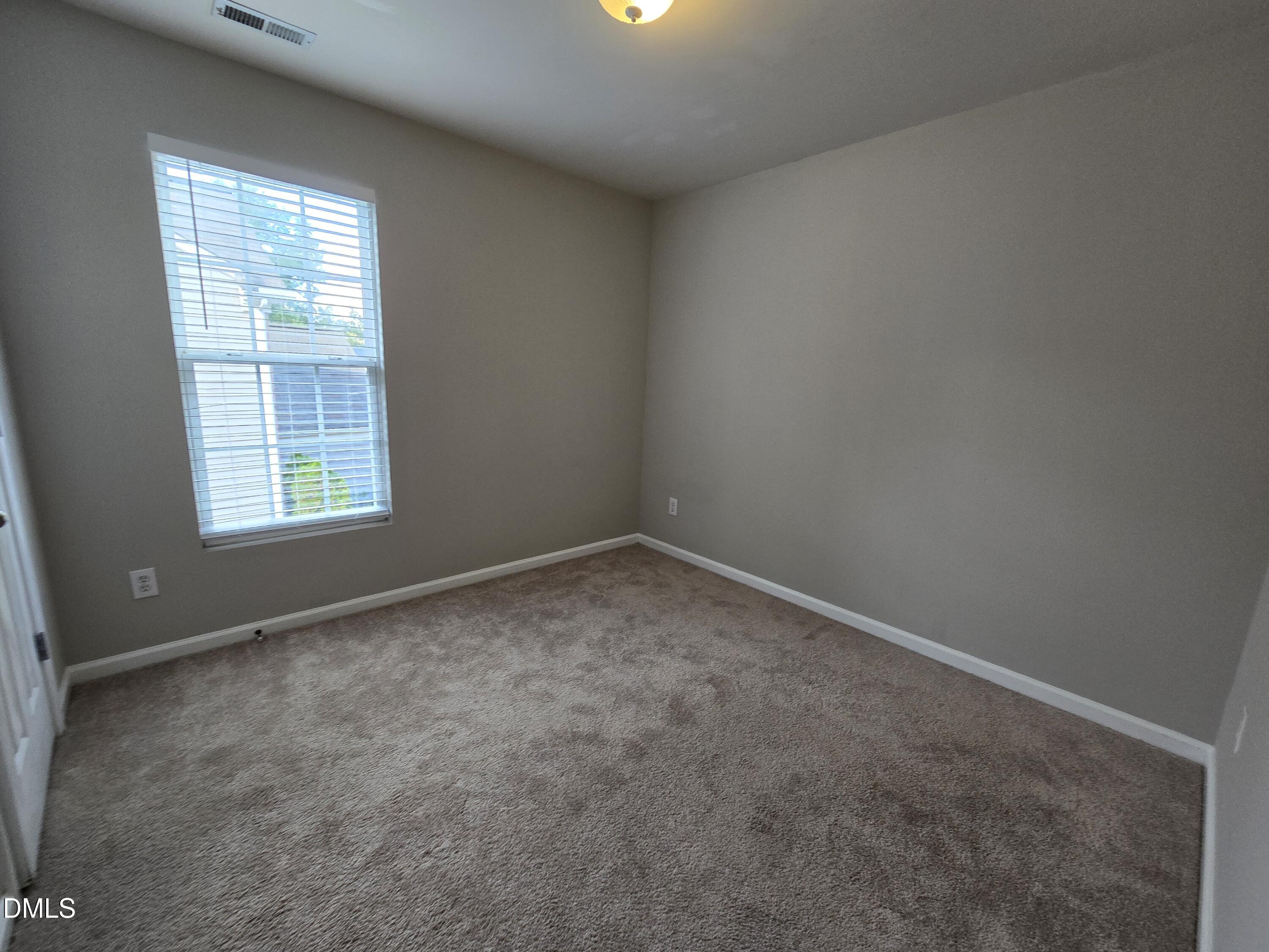 5030 Reservoir Road Raleigh, NC 27610 - Photo 19 of 31 an empty room with a window