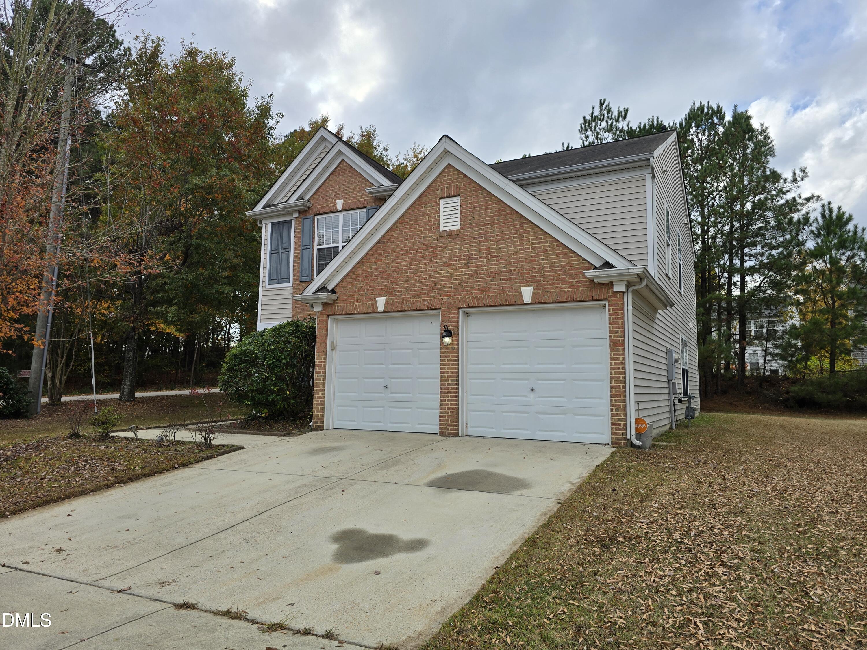 5030 Reservoir Road Raleigh, NC 27610 - Photo 2 of 31 a view of a house with a yard and garage