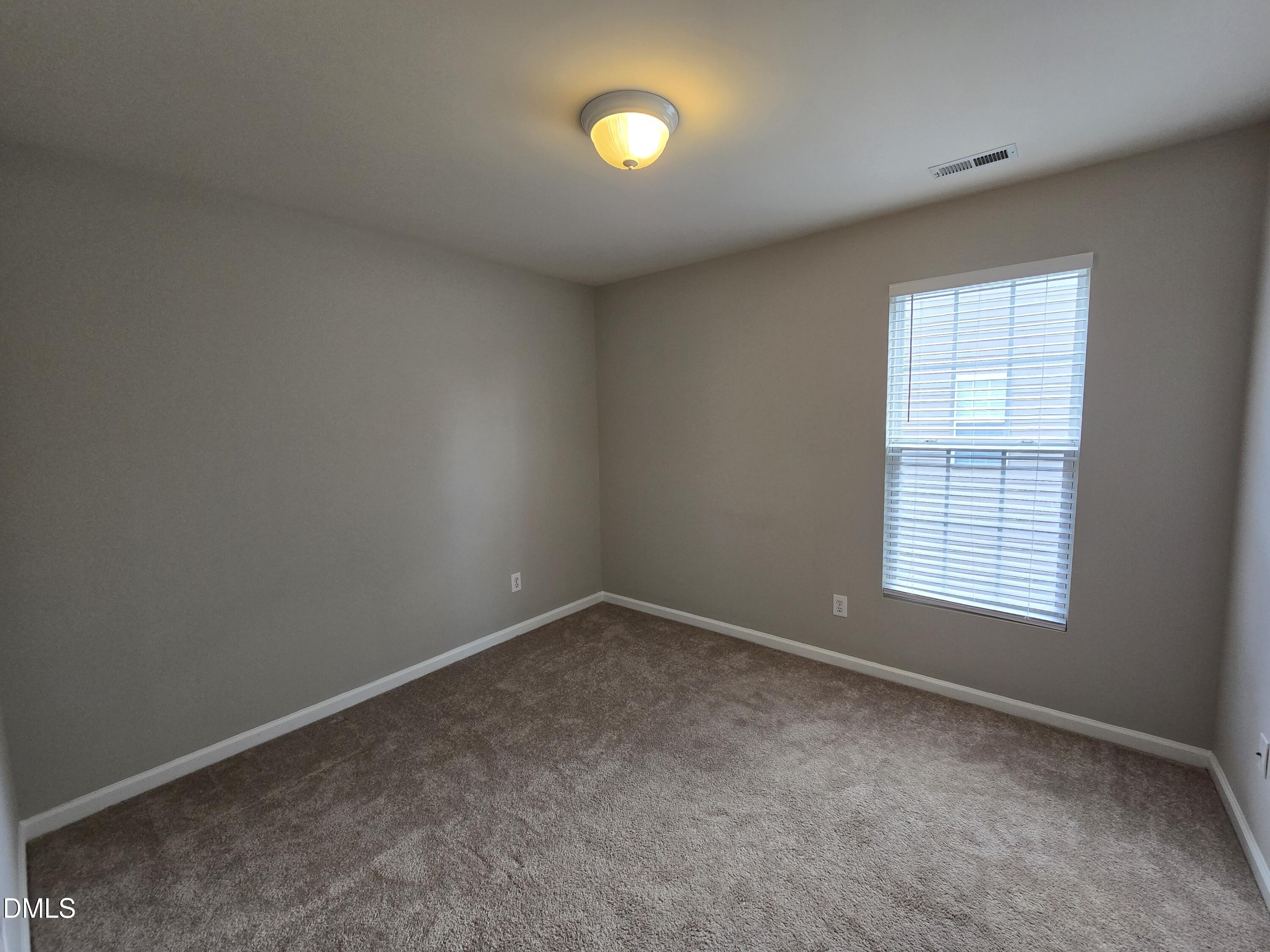 5030 Reservoir Road Raleigh, NC 27610 - Photo 22 of 31 an empty room with a window and an empty space