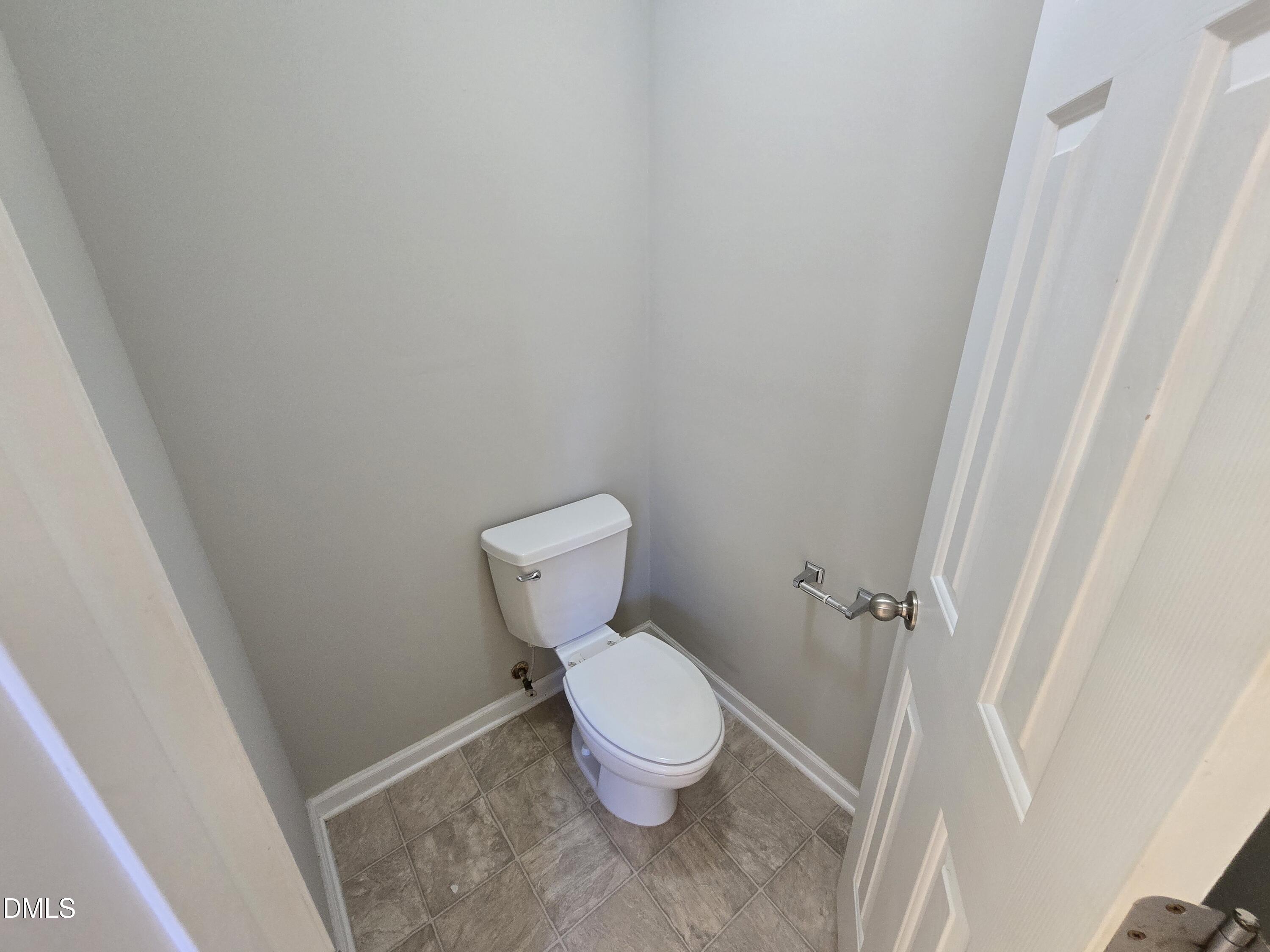 5030 Reservoir Road Raleigh, NC 27610 - Photo 28 of 31 a white toilet sitting next to a shower