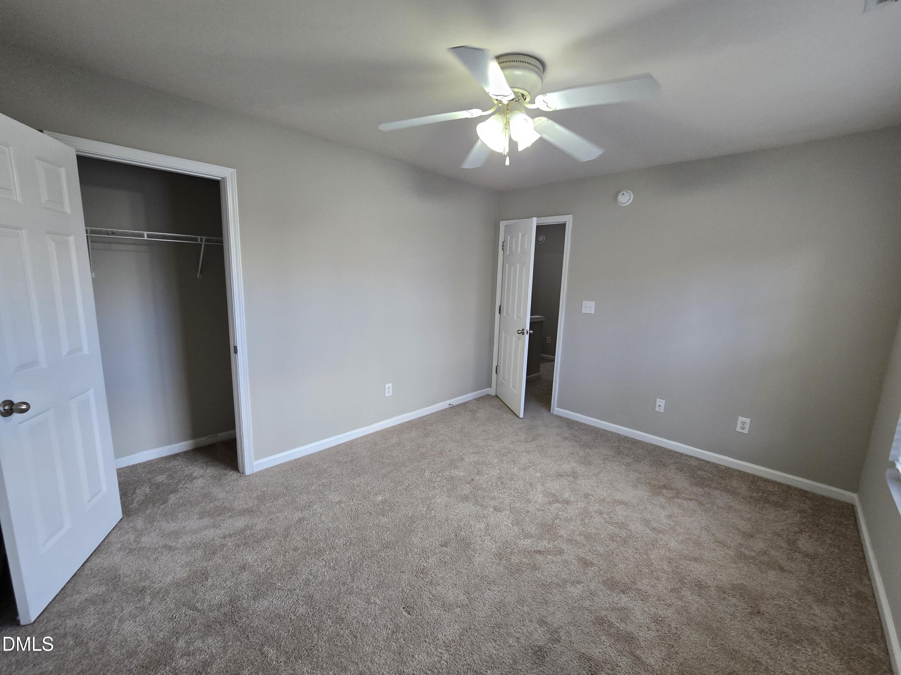 5030 Reservoir Road Raleigh, NC 27610 - Photo 31 of 31 an empty room with chandelier fan