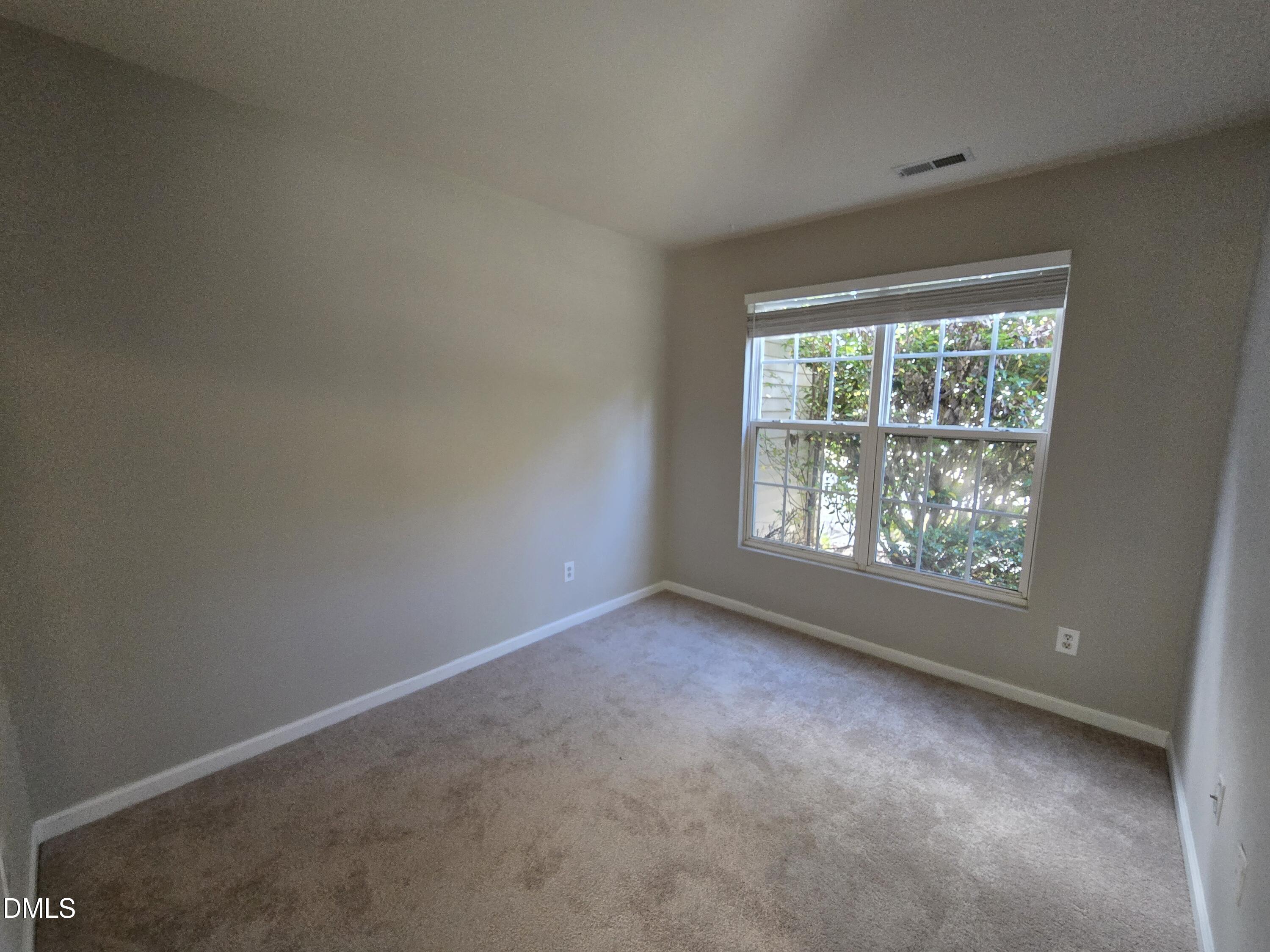 5030 Reservoir Road Raleigh, NC 27610 - Photo 7 of 31 an empty room with windows