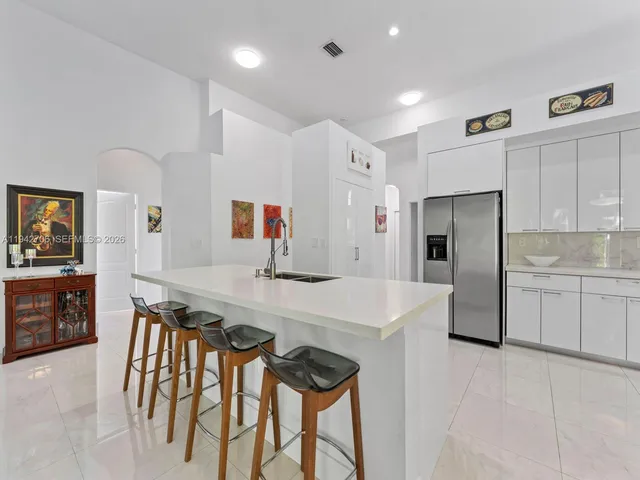 a bathroom with a granite countertop sink a shower and a mirror