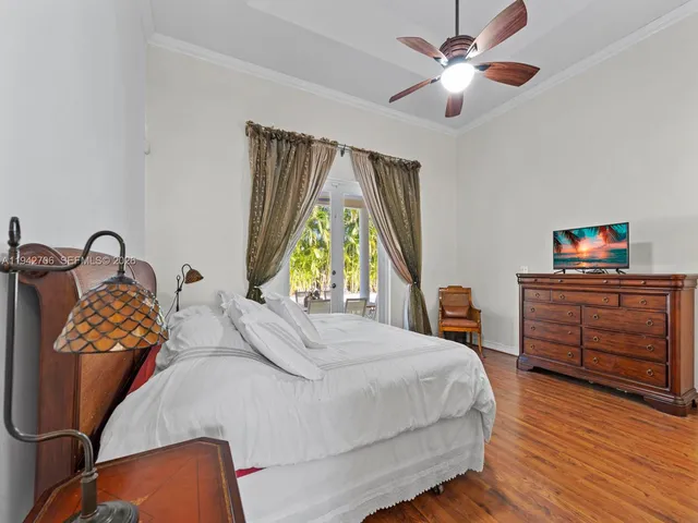 a dining room with furniture and a floor to ceiling window