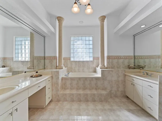 a view of a house with backyard porch and sitting area